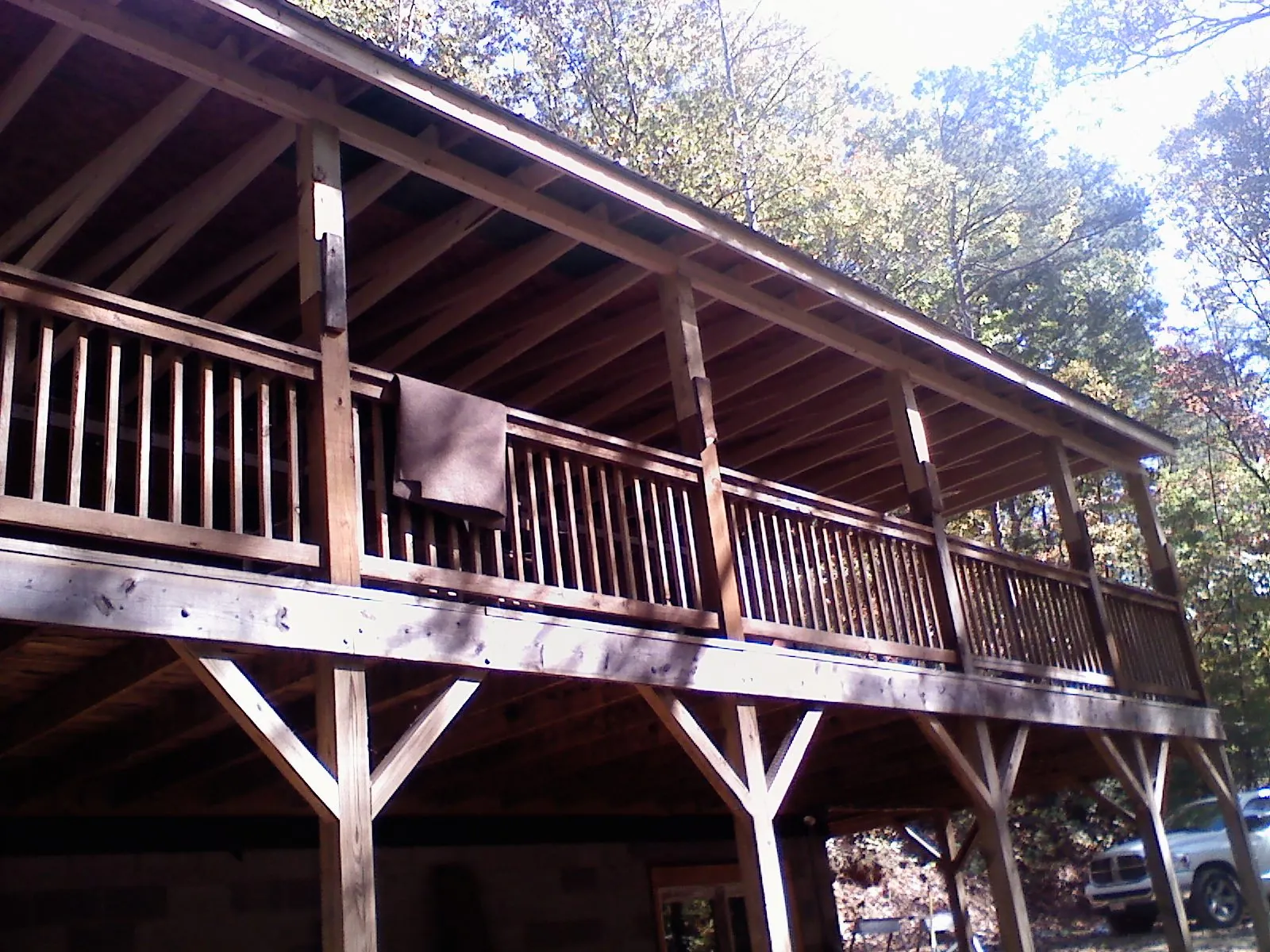 Timber framing under a new elevated porch and deck — Roof Leak Repair in Placitas by Roofing Brothers